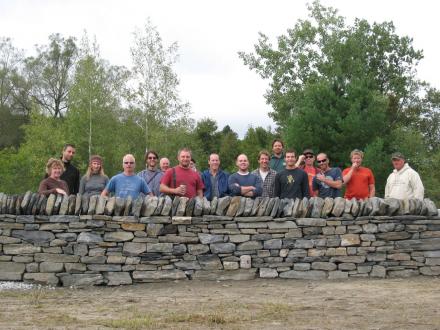 Completed workshop wall and some of the students who built it